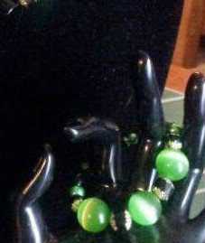 Richpetg's tweet photo. This is a set of necklace, bracelet and earrings made with green catseye and black cathedral crystals https://t.co/XaduUzWURN