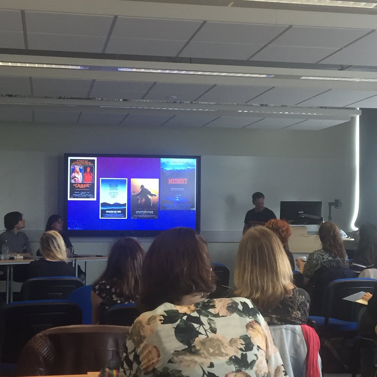 LitTV2018's tweet photo. Dr Simon Brown is up with, ‘From Infidelity Comes Fidelity: Stephen King’s Under the Dome as Serial Television’ #littv2018 #stephenking #serialtelevision @SimonBrownku https://t.co/O6CdDv9TRS