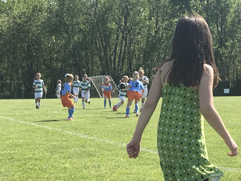 kerberpr's tweet photo. That would be my 6-yr-old and @TonyGlavin_SC Academy soccer player pacing the sidelines coaching big sister’s team at the #TGSCClassic. When the sun wasn’t melting us, she was our 💚s. She loves being on the bench w/@TGSCAsst_DOC and the team #rolemodels #findingherpassion https://t.co/pPxNeH7oGO