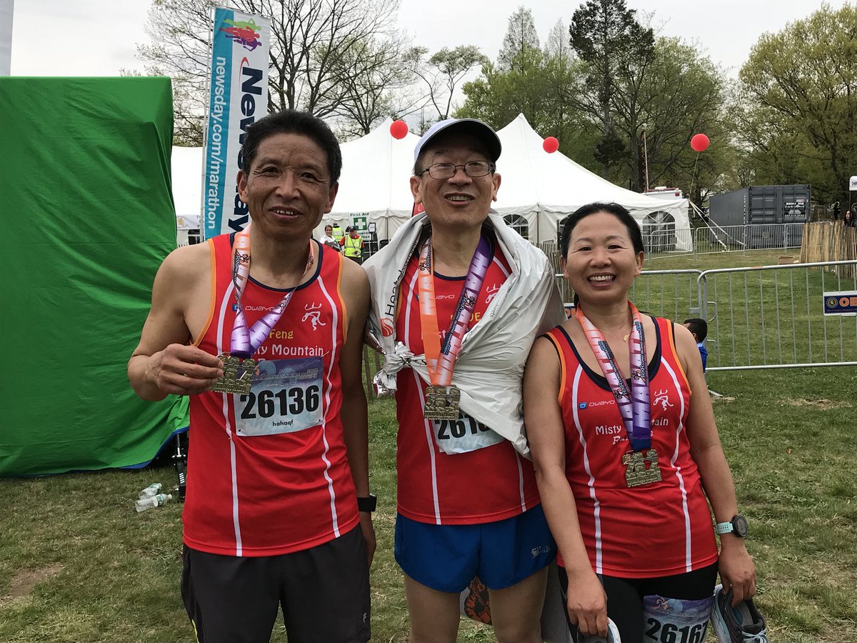 Members of the Misty Mountain Runners celebrate a hard-earned victory after finishing the #LIMarathon