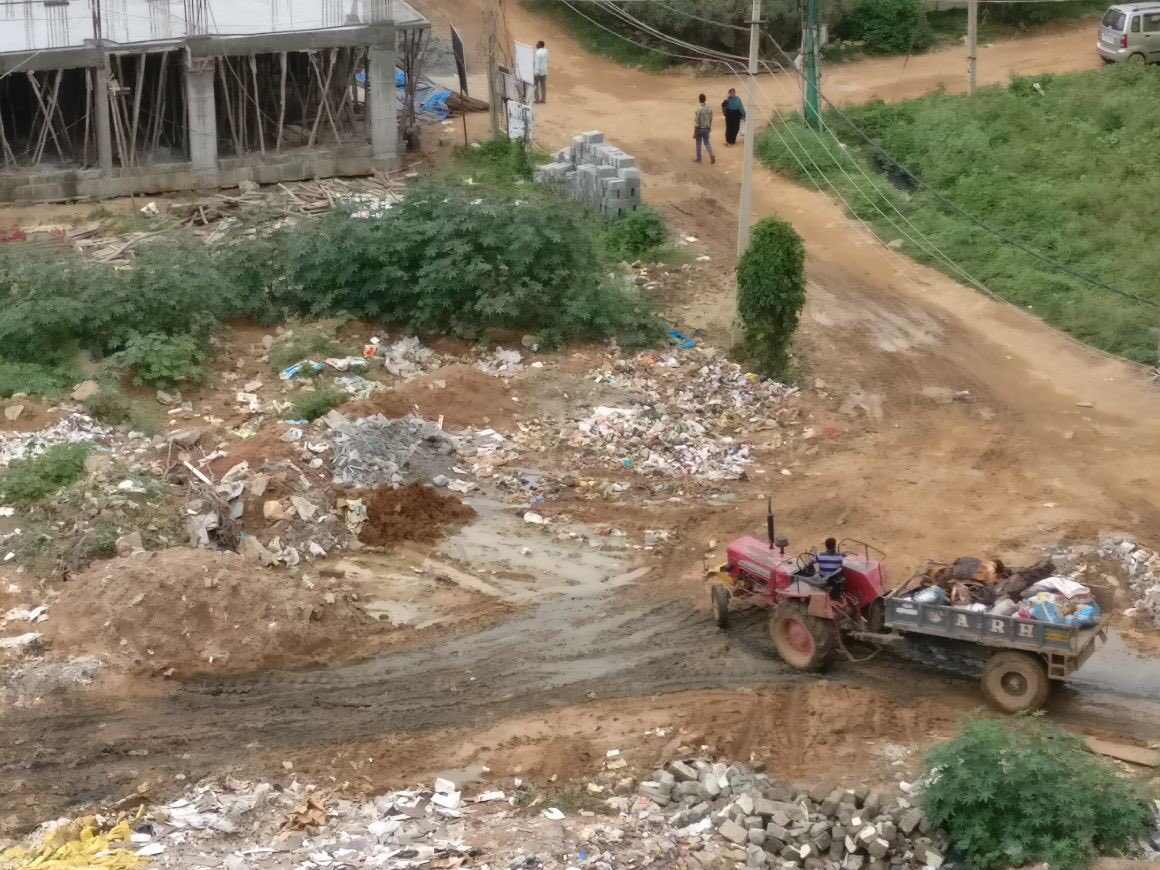OwnersAsp's tweet photo. @mopr_goi illegal dumping of waste and open sewage lines right under the nose of hulimangala panchayat in Electronic City Phase 1 BANGALORE. No action despite repeated complaints. Please look into this. https://t.co/cBHnFbcLVT