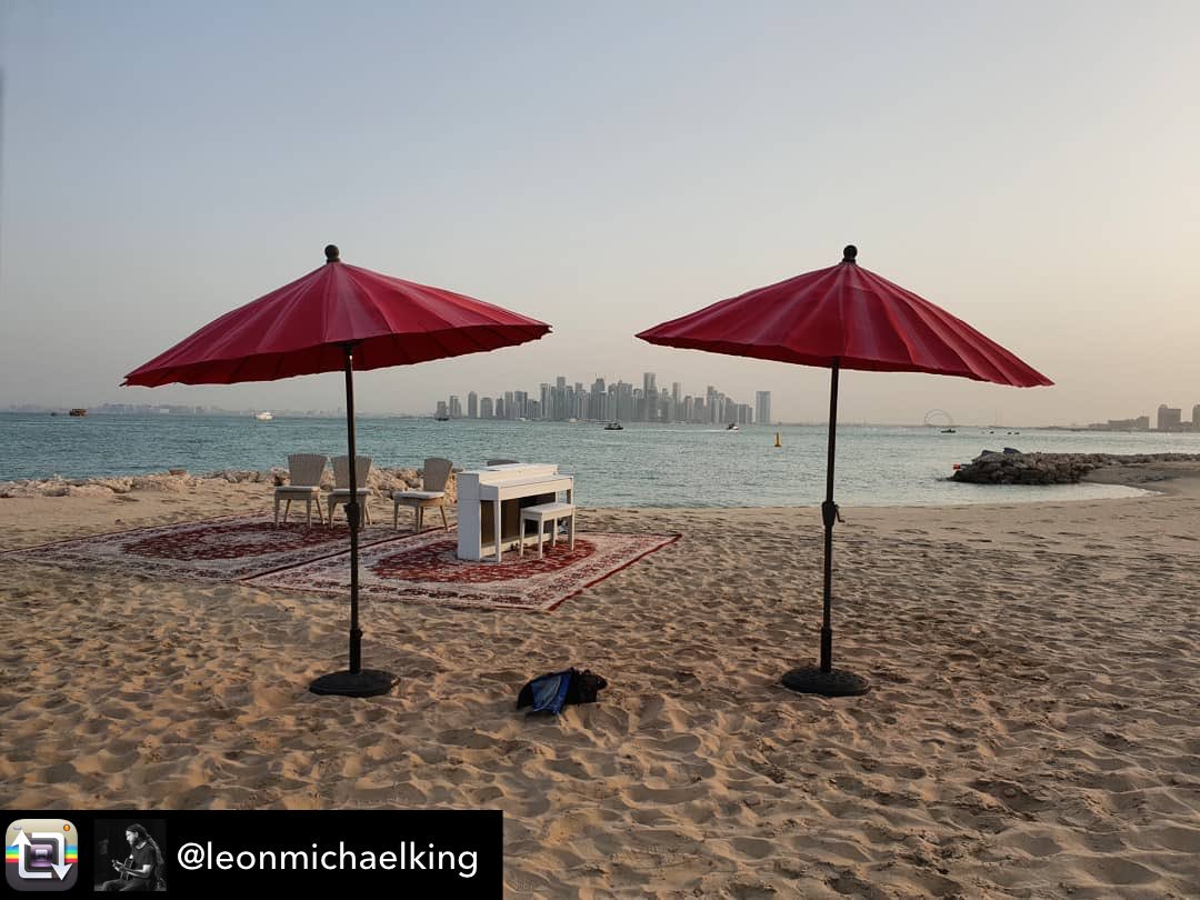 RudyEngland's tweet photo. Collaboration view: @jossstone #totalworldtour in Doha, Qatar 🇶🇦. #waterforyoursoul #projectmamaearth Repost from @leonmichaelking using @RepostRegramApp - Bon. #jstwt #piano #gulf #sea #umbrella #skyline https://t.co/eGEixw56oD