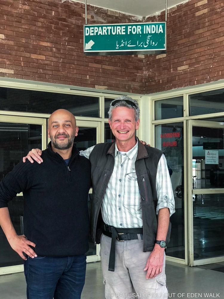 PaulSalopek's tweet photo. Goodbye to #Pakistan. At the #India border with friend @shahidmahmud61 and walking partner @HunzaOnFoot after 1,024 km (638 mi) through #Pakistan. #EdenWalk Map: https://t.co/klTCrNJcfl https://t.co/YYcj4DPYLJ