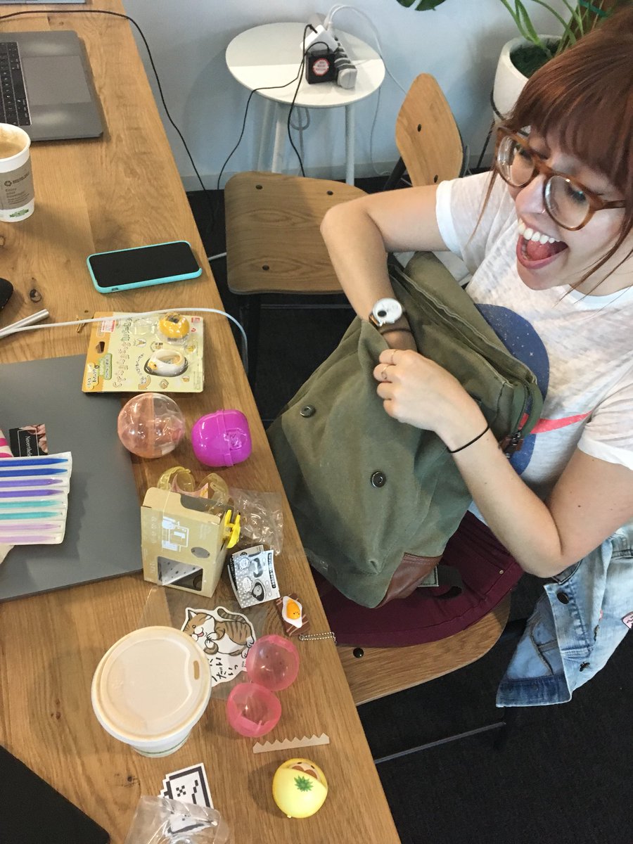 Monica in front of toys from Tokyo. With facial expressions of joy.