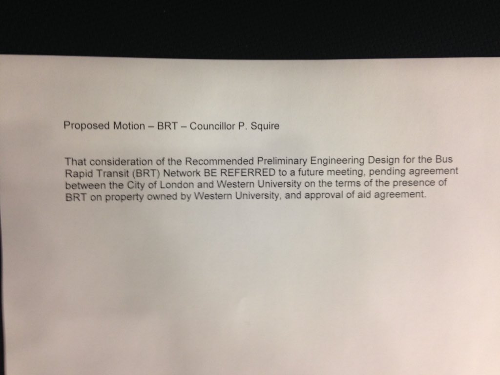 DNewcombeCTV's tweet photo. Clerk handing out wording of a possible motion from @SquirePhil calling for the vote tonight on BRT Environmental Report to be put on hold until a deal reached to permit BRT buses on campus. #LdnOnt https://t.co/mhd98oZsbo