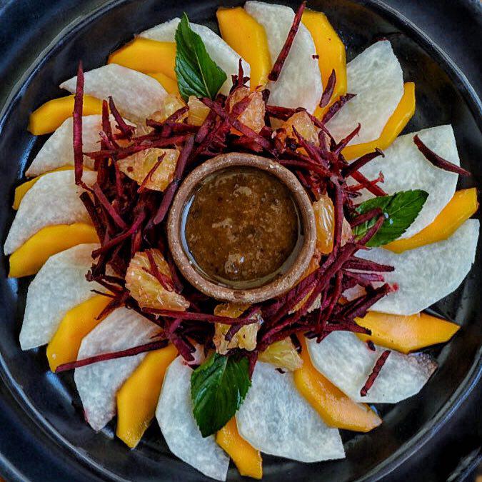 NIDO DE FRUTA. Refrescante mezcla de mango, jícama, betabel y naranja, bañadas en salsa de tamarindo. 
*
Nest of fruit. A refreshing mix of mango, jicama, beet and orange, bathed in a tamarind sauce that was sweetened in a natural and nutritious way.