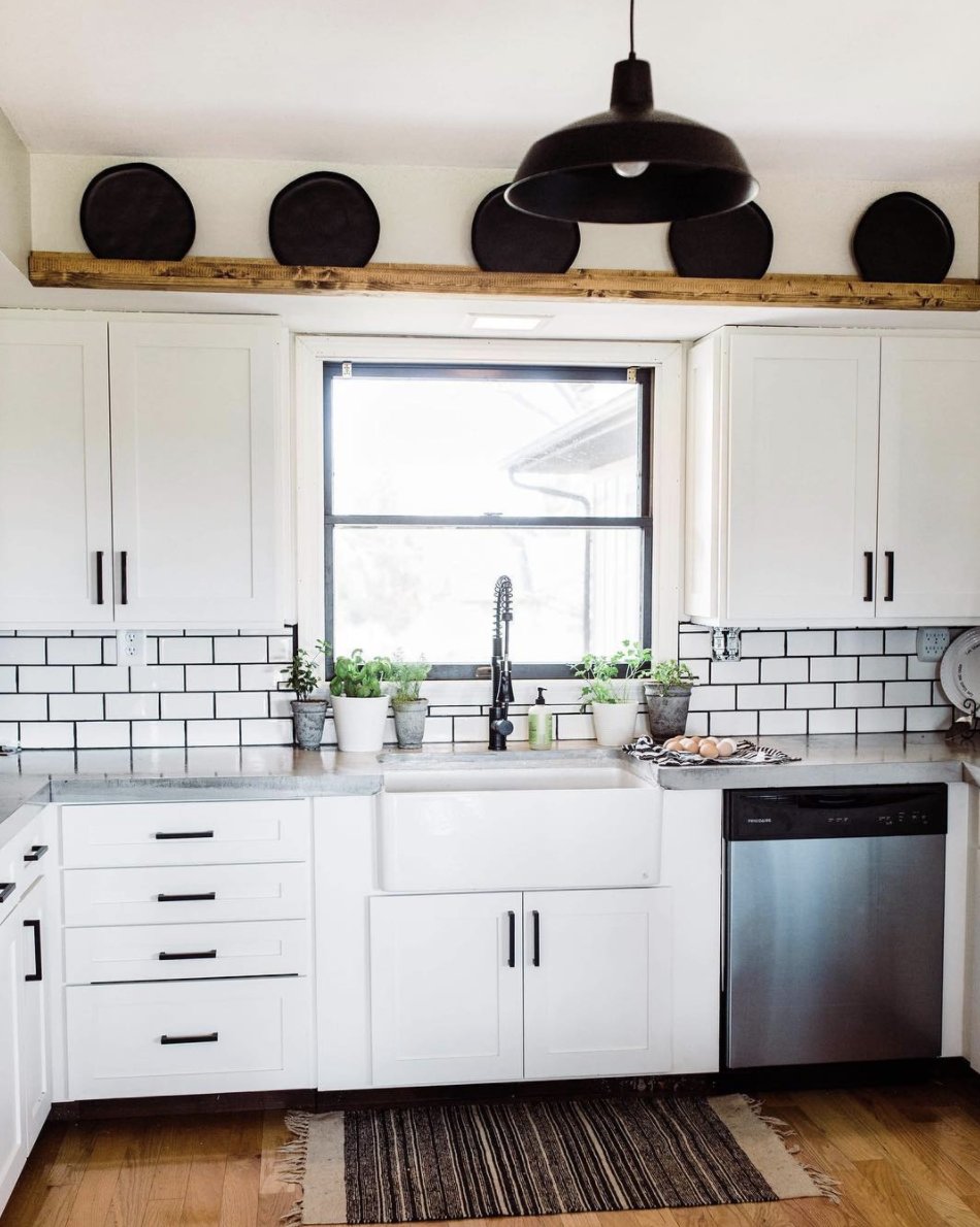Check out the contrast in this #kitchen from @lexie_schatz of #TheMonetaHome. Love the white subway tile and the pop of the black grout.  #kitchendesign #diy #modernfarmhouse #industrial #concretecounters #renovationproject #remodeledkitchen