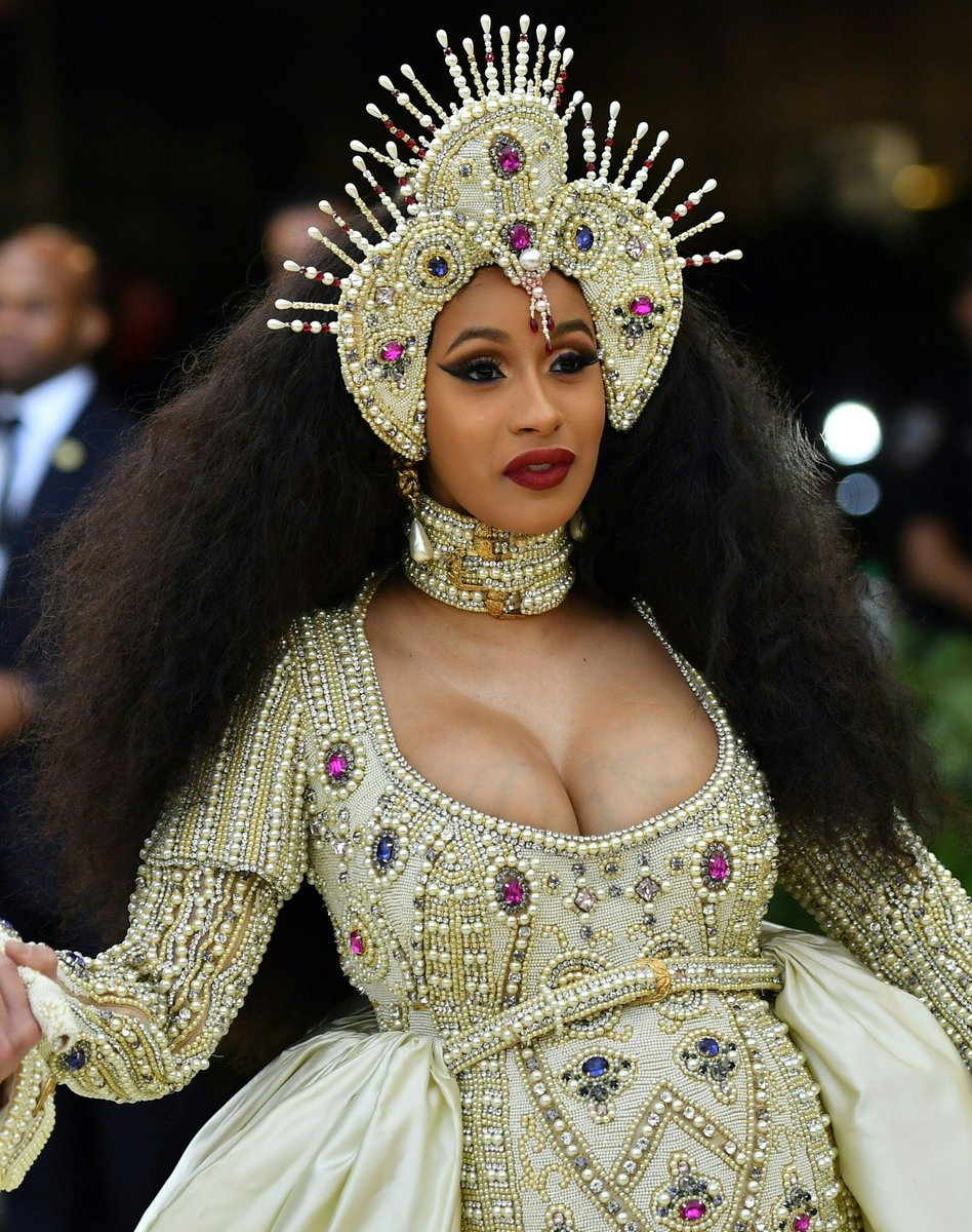 InStyle's tweet photo. Gold dresses, overskirts, dramatic trains, and headpieces were the major themes of the #MetGala red carpet. See some of the most over-the-top headpieces of the night! https://t.co/lIedAXdBwL