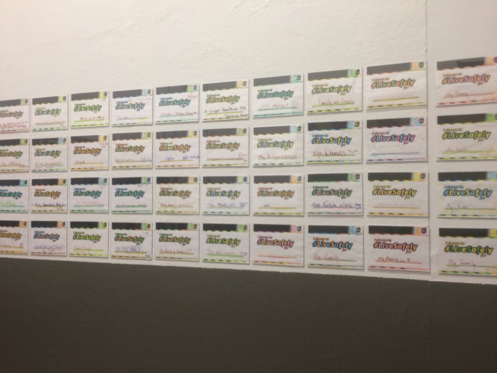 Gaithersburg Hub employees post on the wall why they Live Safely