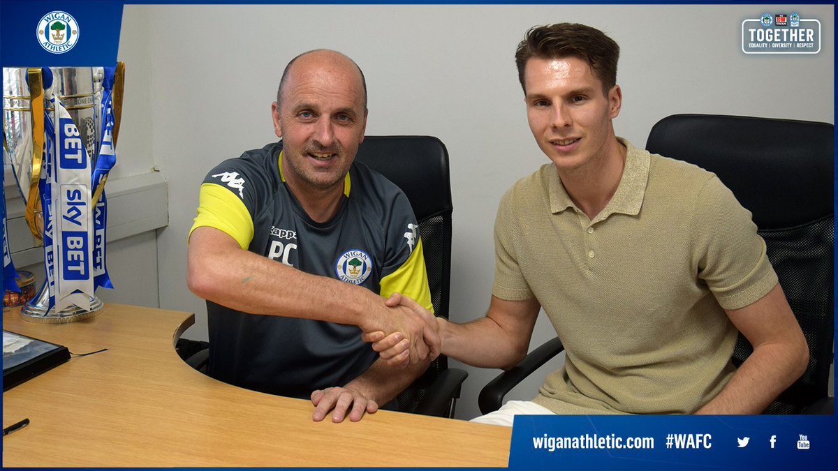 LaticsOfficial's tweet photo. ✍️😃 We are delighted to confirm manager Paul Cook has put pen to paper on a new four-year contract with Wigan Athletic!

Full story 👇

https://t.co/HjrJCVMSIX

#wafc 🔵⚪️ https://t.co/pamcy64Nom
