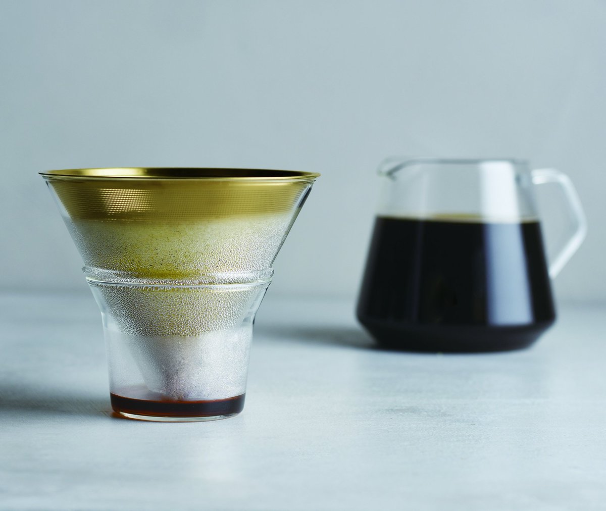 This pour-over coffee maker from Kinto features a solid walnut base, and Ki...