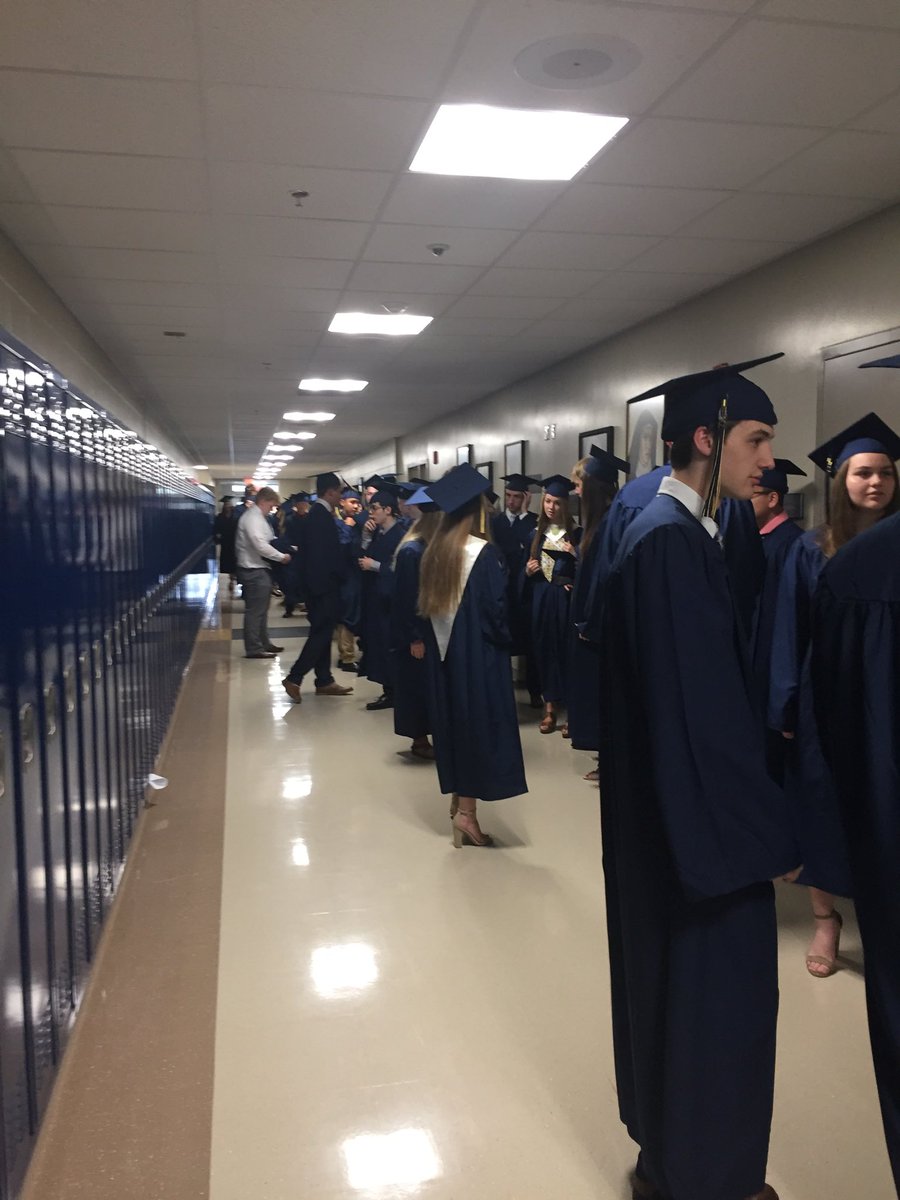 First event in cap and gown!  Marian Day Prayer Service.  First one lining up in the new school!!