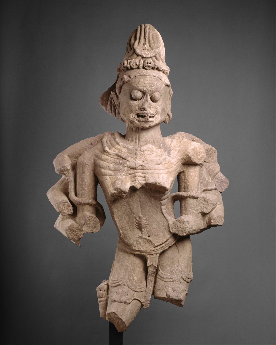 An over 1000 year old heavily maimed sandstone sculpture of Chamunda probably belonging to modern day Madhya Pradesh. The scorpion is seen clearly climbing up the torso. Also seen is the jata mukuta of skulls. Now held at the met museum in nyc.  https://www.metmuseum.org/art/collection/search/38152