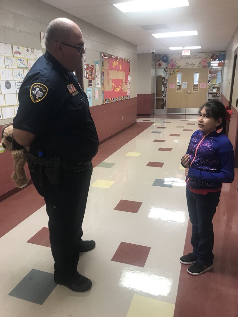 NjohnsonPierce's tweet photo. Mia Cuevas, 5th grade student, explains to Officer Lopez her contributions and work on Autism Awareness #APierceStrong #WeMakeItHappen #GoMiaGo https://t.co/upYMd85OB7