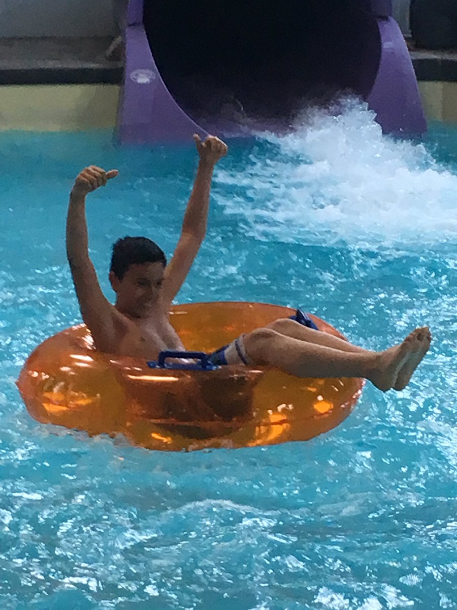 MrsZemp5th's tweet photo. First ride on the water slide is two thumbs up for David. https://t.co/0jjrSmW341