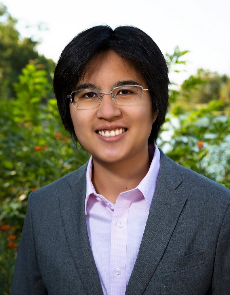headshot of abigail wearing a purple shirt and grey blazer