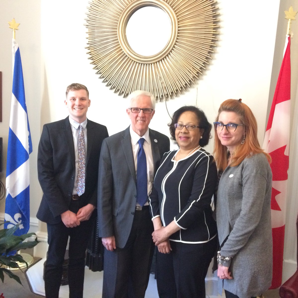 Left to right: Thomas Simpson from CNIB, Optometrist Dr. Michael Dennis, Senator Marie-Françoise Mégie and Laurèl Craib from the Canadian Association of Optometrist pose for a photo.