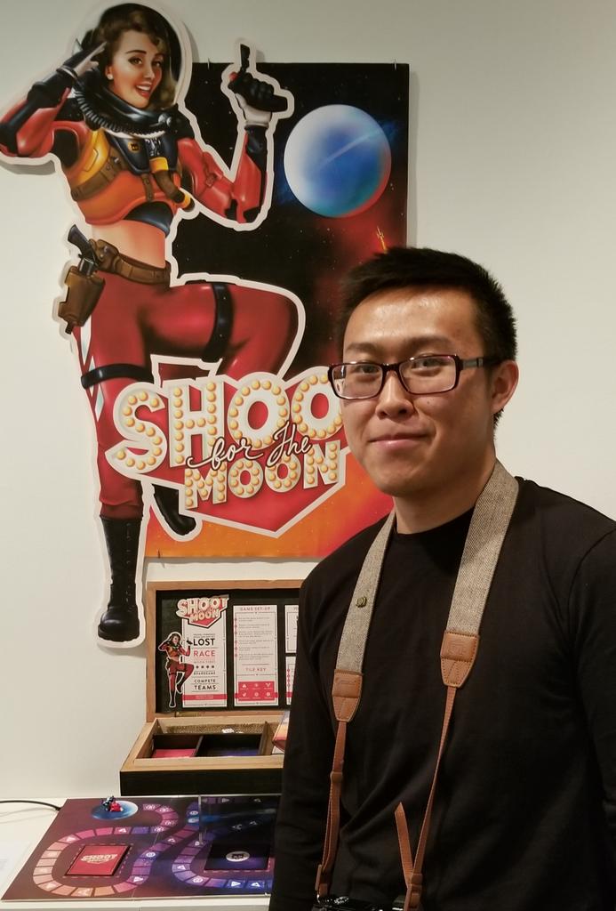 FIT_artdesign's tweet photo. Race from Earth to the Moon!Jason Huang, Graphic Design senior, going places with "Shoot for the Moon" board game. "This promotes friends and family to gather for an unforgettable experience." #GraduatingExhibit18 https://t.co/vtEmN4xZJQ