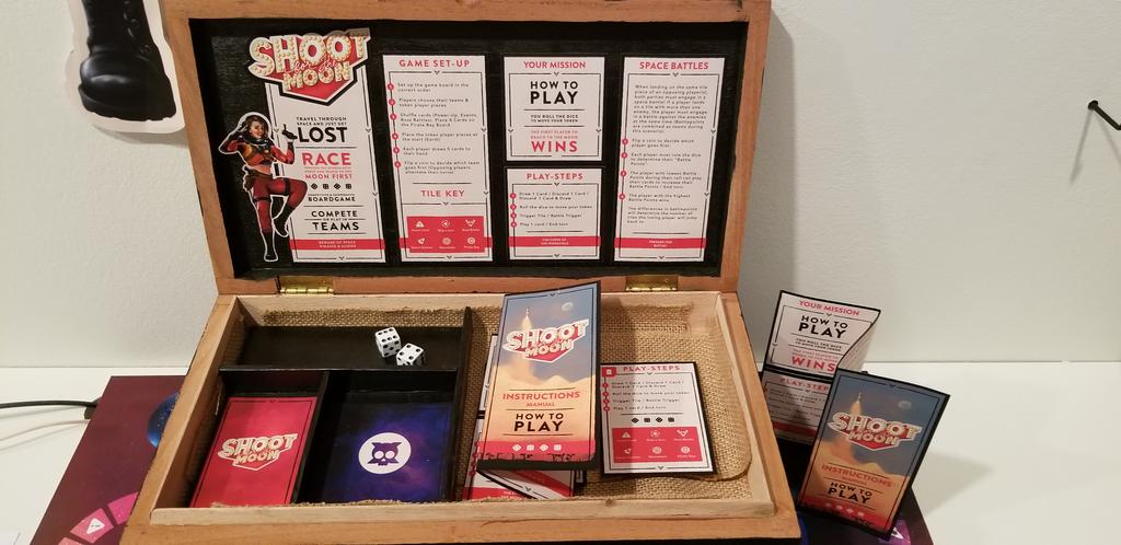 FIT_artdesign's tweet photo. Race from Earth to the Moon!Jason Huang, Graphic Design senior, going places with "Shoot for the Moon" board game. "This promotes friends and family to gather for an unforgettable experience." #GraduatingExhibit18 https://t.co/vtEmN4xZJQ