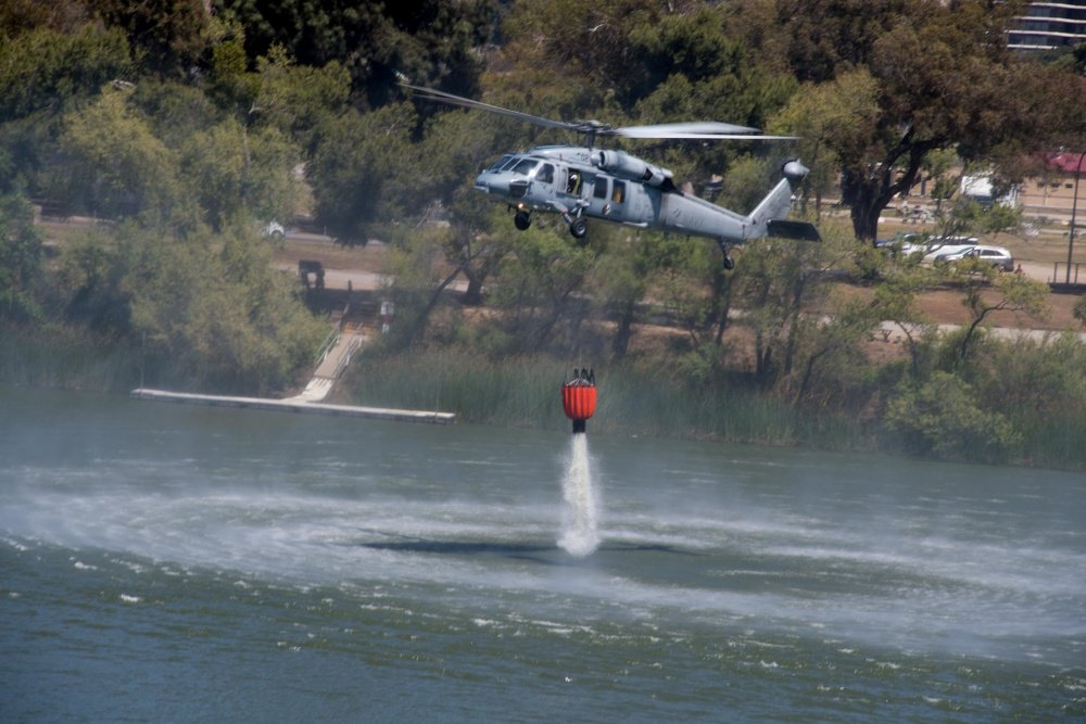 flynavy's tweet photo. Recently the "Merlins" of #HSC3 and other Navy #seacombat helicopter squadrons flew their MH-60S Seahawk helicopters in the Cory Iverson Wildland Firefighting Exercise in conjunction with CALFIRE. Last year, Navy HSC squadrons helped fight the #LilacFire in northern SD County. https://t.co/H7bmS0Wojm