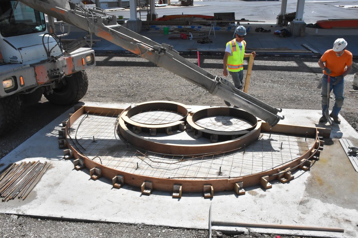 Summerfest's tweet photo. The iconic smile at the @amfam North gate has been poured with help from @EUA and @cgschmidtinc! We can't wait until you can see it in person! https://t.co/5JEjBdpTwa