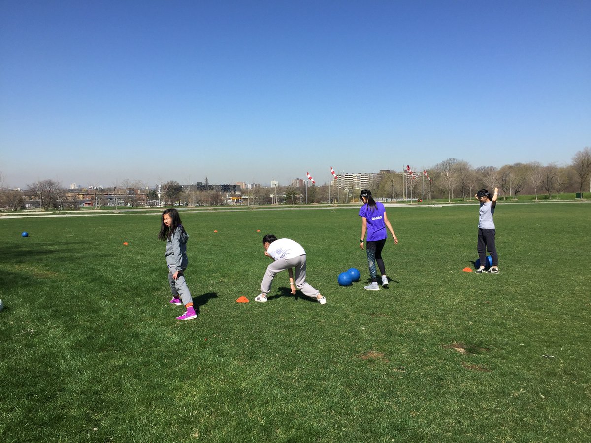 Girls trying to throw goalballs