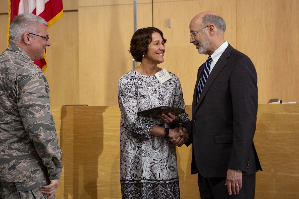 Photo of Governor Wolf shaking hands with PA DMVA employee