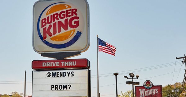 Adweek's tweet photo. A Massachusetts @BurgerKing just asked the neighboring @Wendys to prom. Wendy's said yes! https://t.co/IT9G05sSf9 https://t.co/9pXqwAmatZ