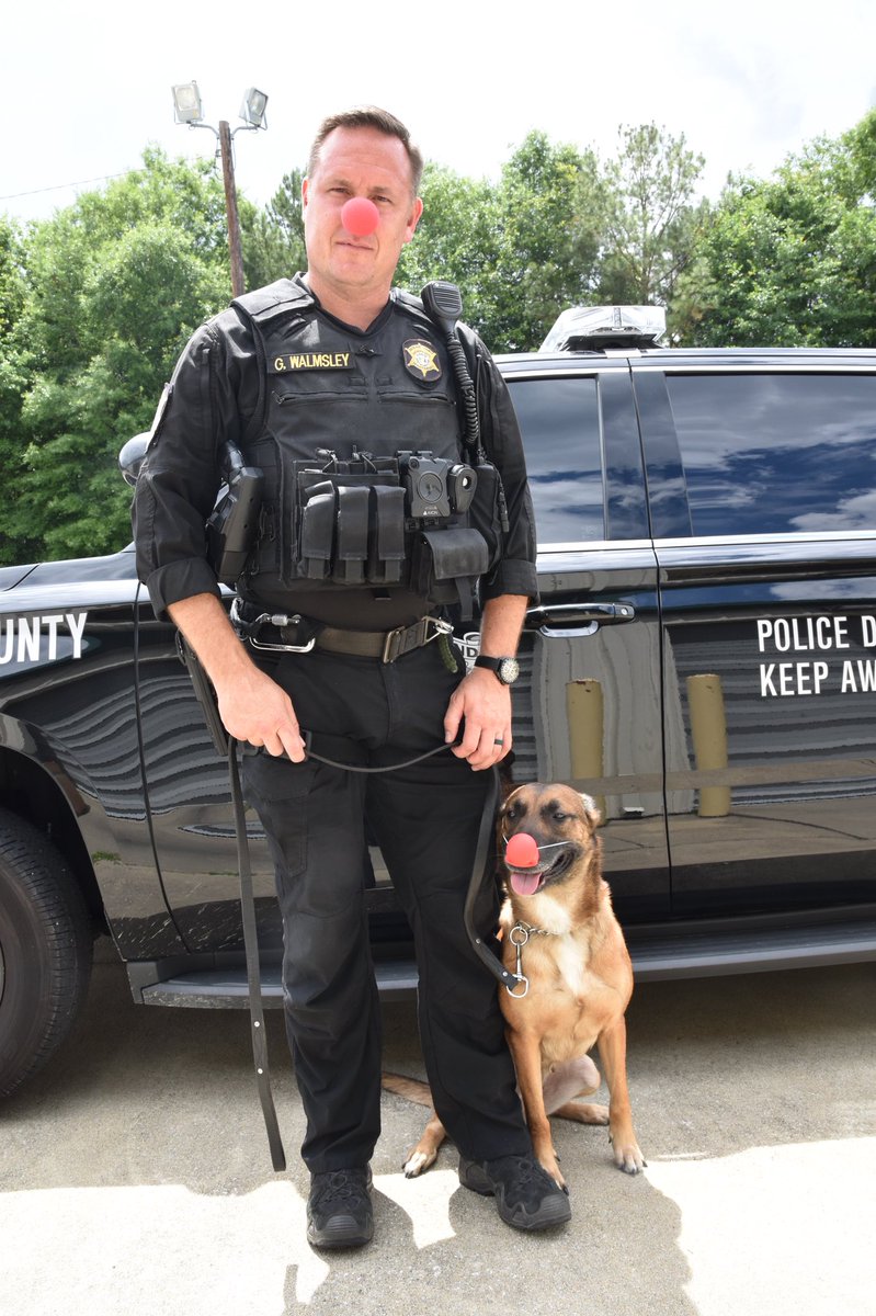 K9 Emy and Corporal Gavin Walmsley sporting their red noses in support of #RedNoseDay2018 to raise awareness and funds to help children in need!! Spread the word for our kids!! <a href="/Gavin_Walmsley/">Gavin Walmsley</a> #RedNoseDay