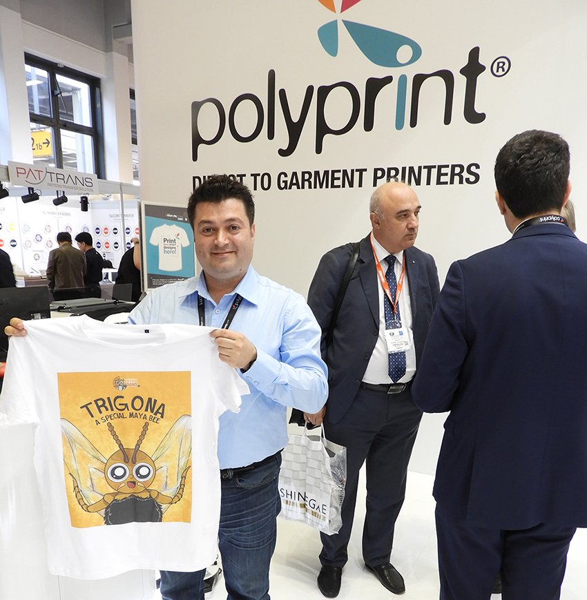 NHellmuth_'s tweet photo. @PolyprintDTG T-shirt printer booth at FESPA 2018 kindly did test prints with TexJet of T-shirts for MayanToons (children’s educational programs). Thank u Chrysopigi Vardikou &amp; Dimitris Stavrakidis &amp; polyprint team https://t.co/52tHcDqVF0