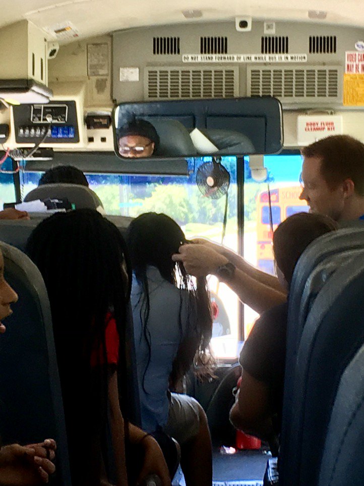 rlawrence_pike's tweet photo. Mr. Bowman, not your average gym teacher. Braiding hair on the way back from swimming. @PikeSchools @ECES_Pike https://t.co/XMV07pp2PJ