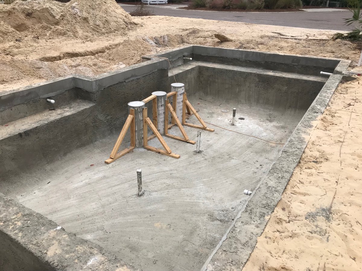 DixVen's tweet photo. How do they install Bar Seat in a pool? It starts with plumbed up conc tube forms, concrete and 10 days to cure. So, now you know! https://t.co/Nttn5hhuoN