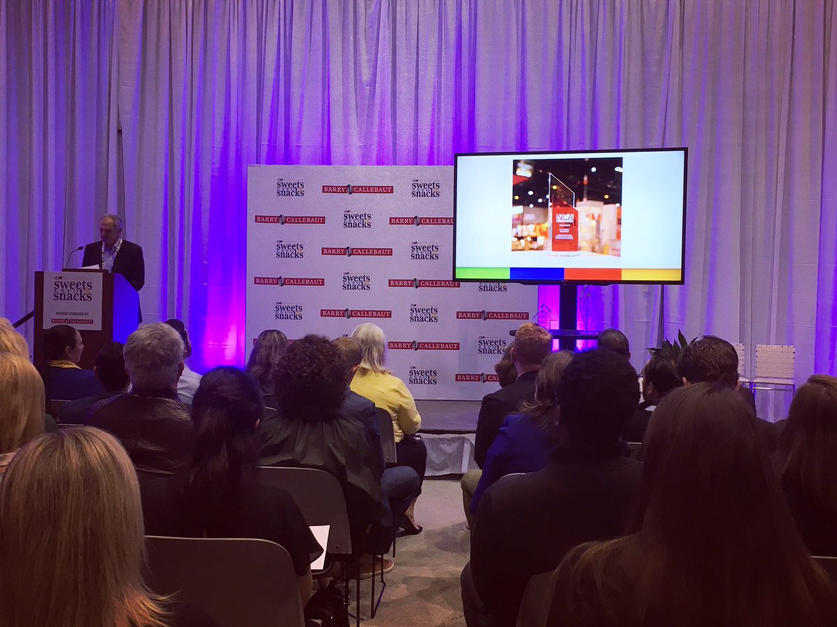 CandyUSA's tweet photo. Announcing the new Ruby Award at the Most Innovative New Products Awards ceremony. Named after recipient @BarryCallebaut's Innovative, new ruby chocolate. Congratulations! #SSE18 https://t.co/HDtyi9NuGc