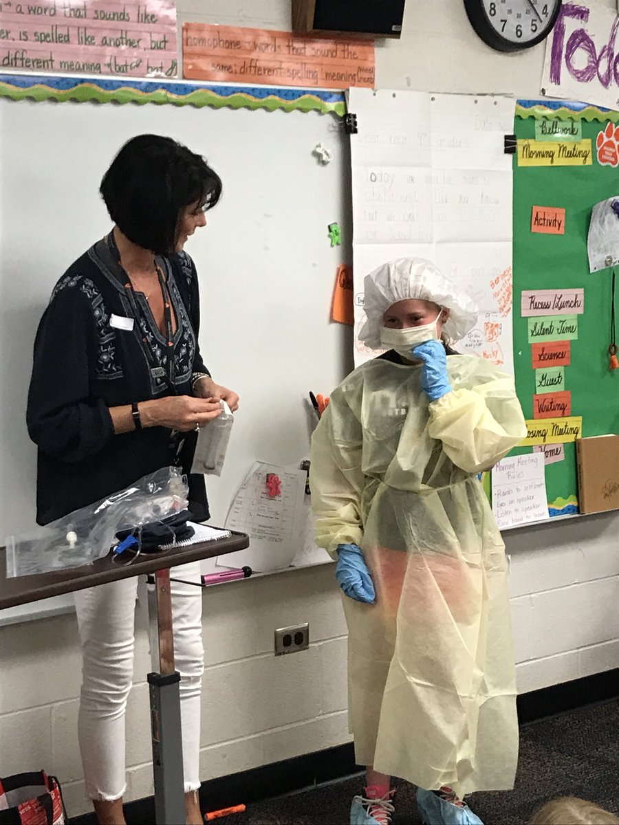 Career presentation…Ava’s mom shows what she needs to wear as a pharmacist to prepare medications for patients. #CFEVS