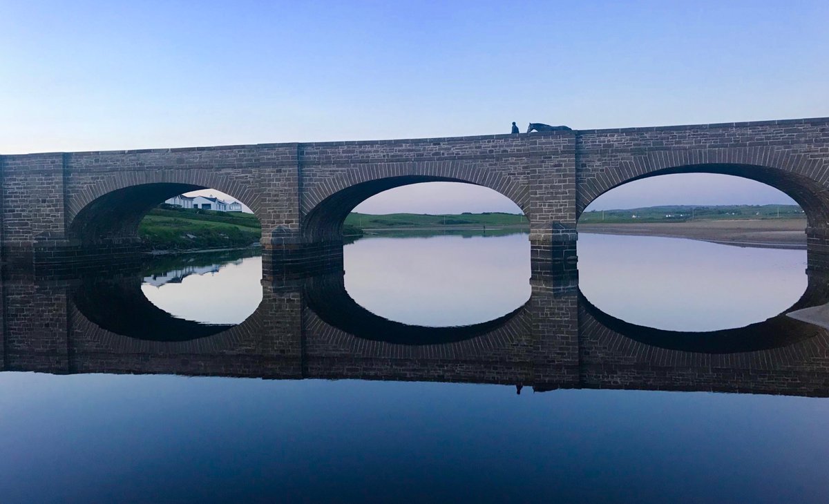 jkphoto68's tweet photo. One man and his horse cross the bridge late in the evening after working out on the beach at Lahinch. #iphone7 https://t.co/p86bygB2uh