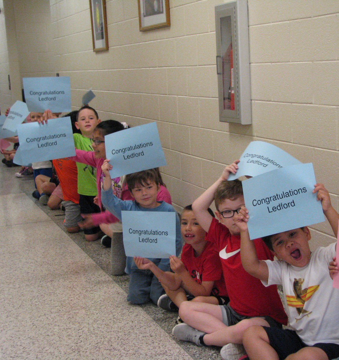 FriendshipElem's tweet photo. @dcsnc FES Cougar Pride! We were thrilled for former students (now seniors in Class of 2018) dressed in cap and gown walk our halls as students congratulated them! https://t.co/L4gxebZFoz