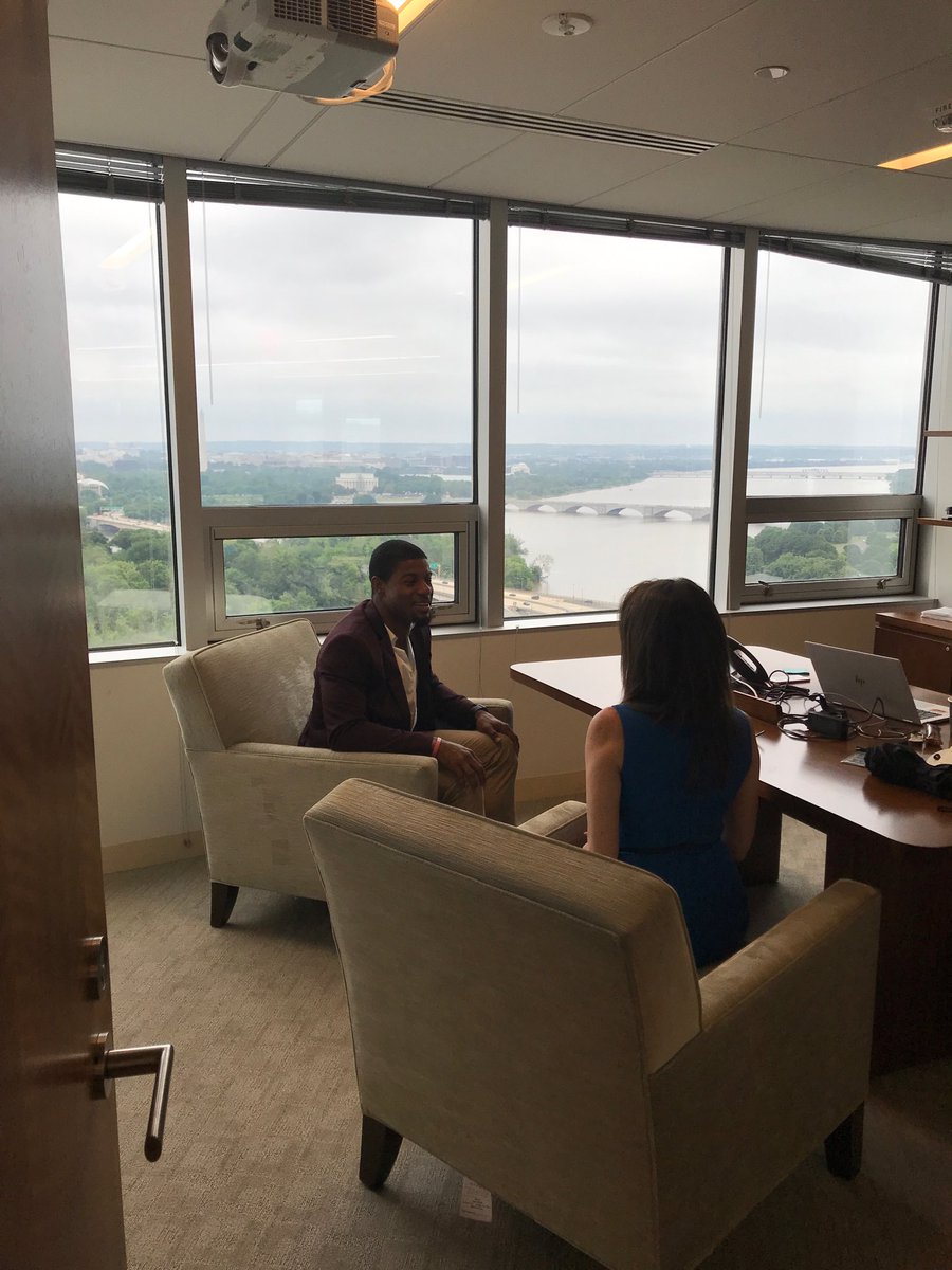 Glenn148's tweet photo. PwC Deana Mary meeting with NFL defensive back Reggie Mclain (a friend of PwC) as they talk about latest issues in Sports Intelligence. https://t.co/0QSYhjp6jI