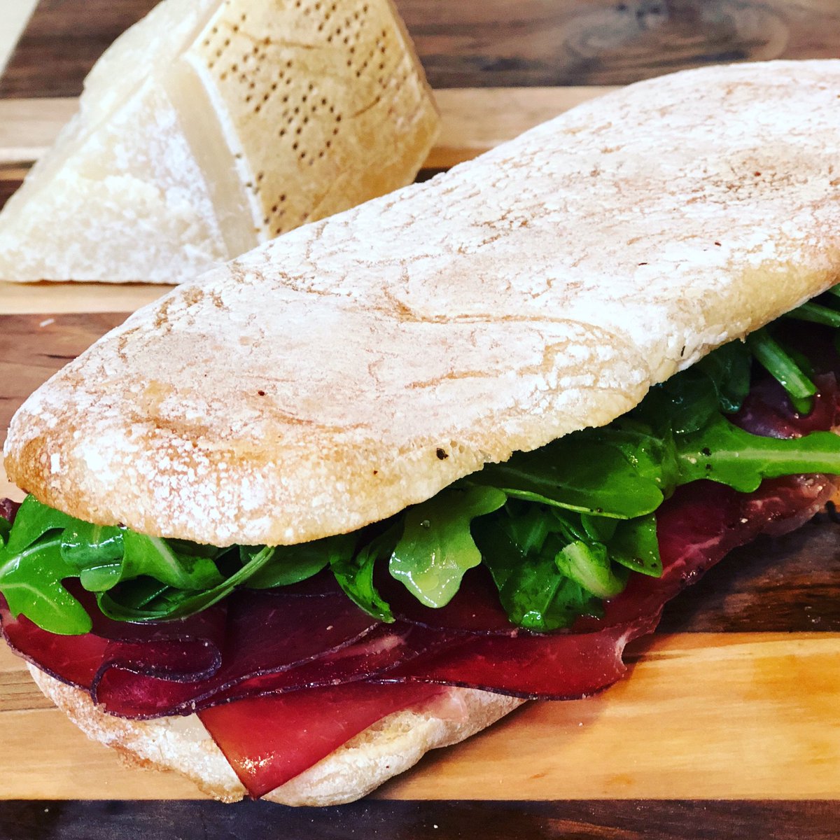 #Bresaola is a air-cured beef that is chewy but tender with a clean, fresh flavor that will beat the summer heat. We've paired it with parmesan, arugula, lemon, and olive oil. Pack this sandwich in your picnic basket this summer. #mondomarket #denver #denverfood #denverfoodie