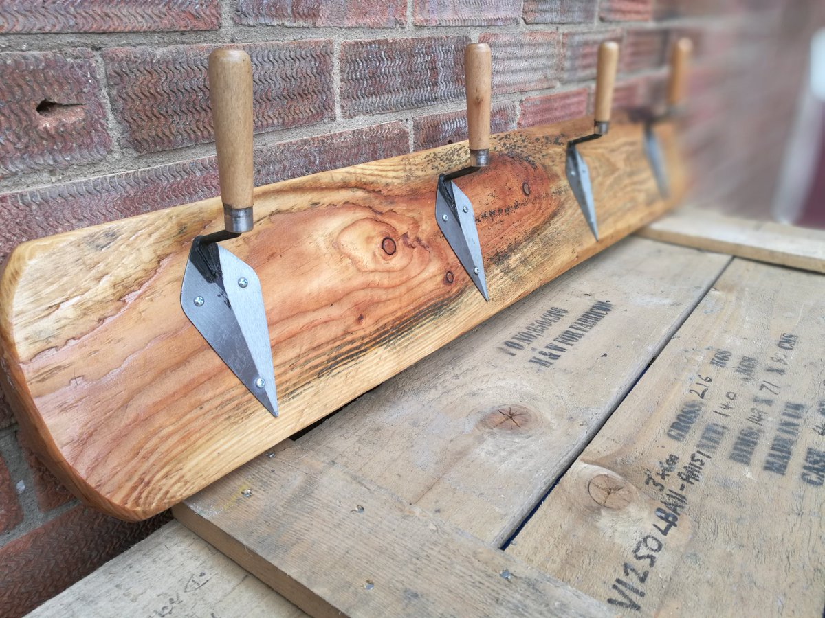 Upcycled pointing trowels affixed to #reclaimedwood section which has been sanded &amp; oiled to create an unusual coat rack