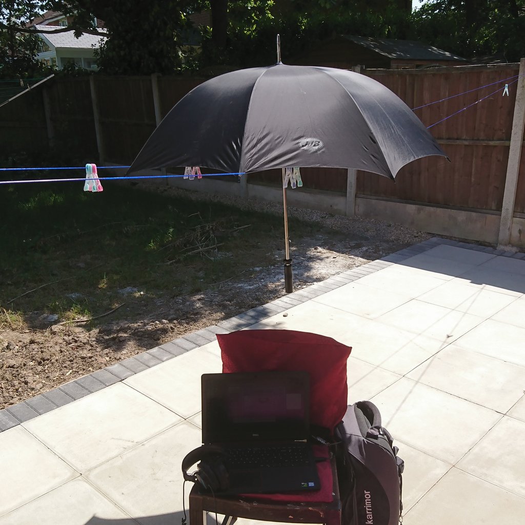 Macousti's tweet photo. This is how you work on a hot day outside and keep your laptop cool at the same time if you have no parasol. Golf umbrella suspended  on a double washing line. Sorted. #audio #samplelibrary #composer #summer #sun #umbrella #dell https://t.co/SyoGOBqAS0