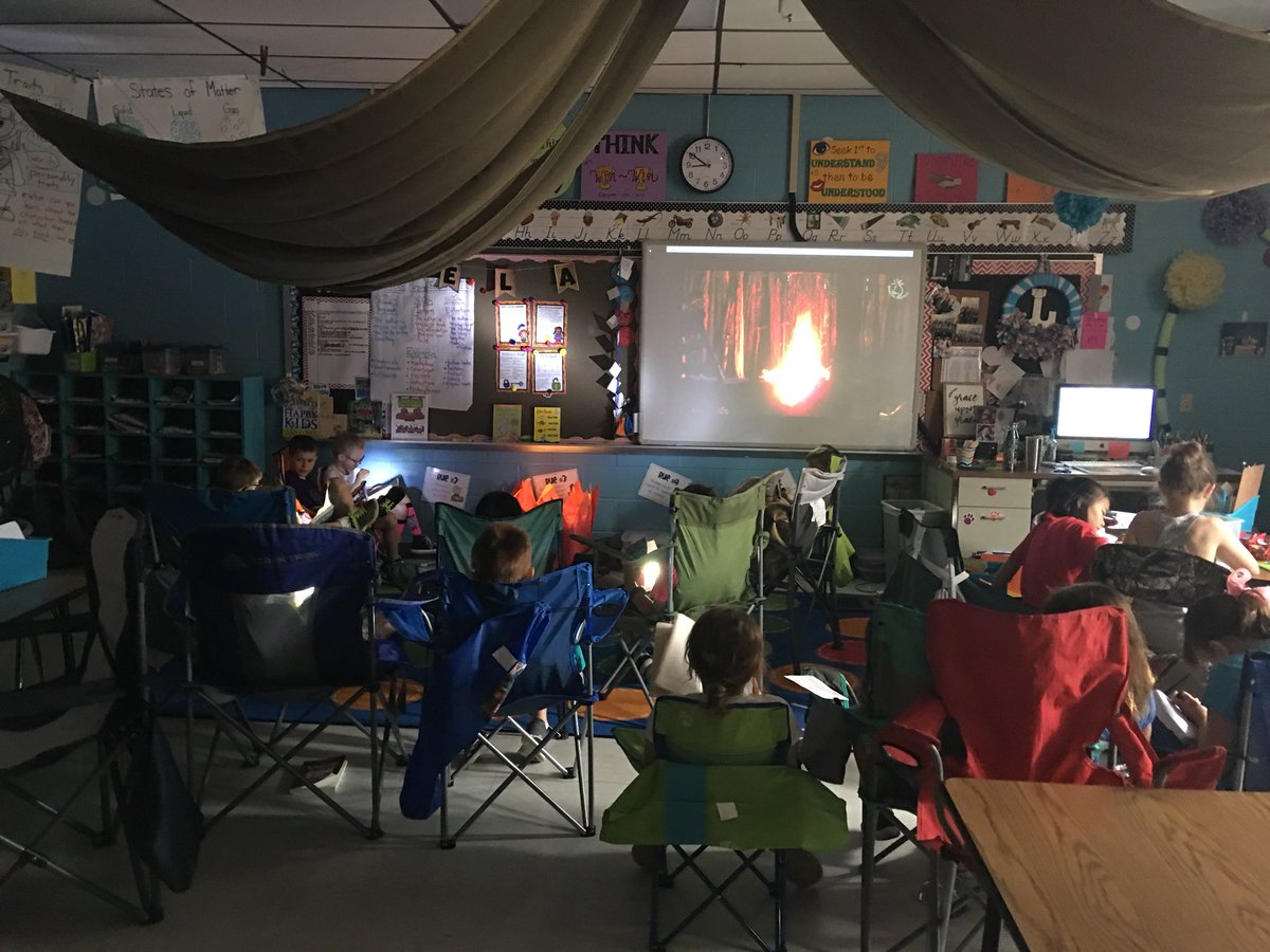 Reading in front of a campfire is the best! #camplearnedalot #flashlightreading