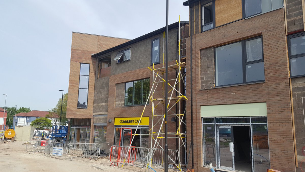 TriangleArch's tweet image. External works progressing and the first splash of colour appearing at the @rbhousing Strand Community Hub in #Kirkholt. Signs up too! #SignsofProgress #Badsignpun