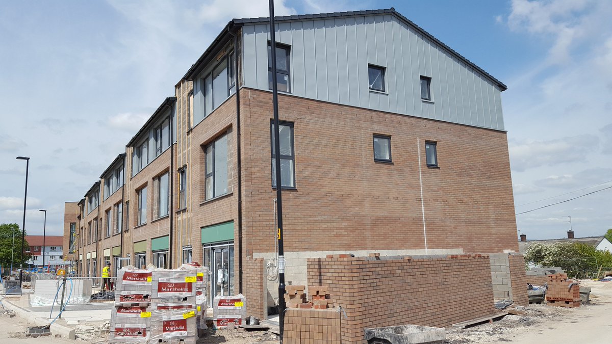 TriangleArch's tweet image. External works progressing and the first splash of colour appearing at the @rbhousing Strand Community Hub in #Kirkholt. Signs up too! #SignsofProgress #Badsignpun