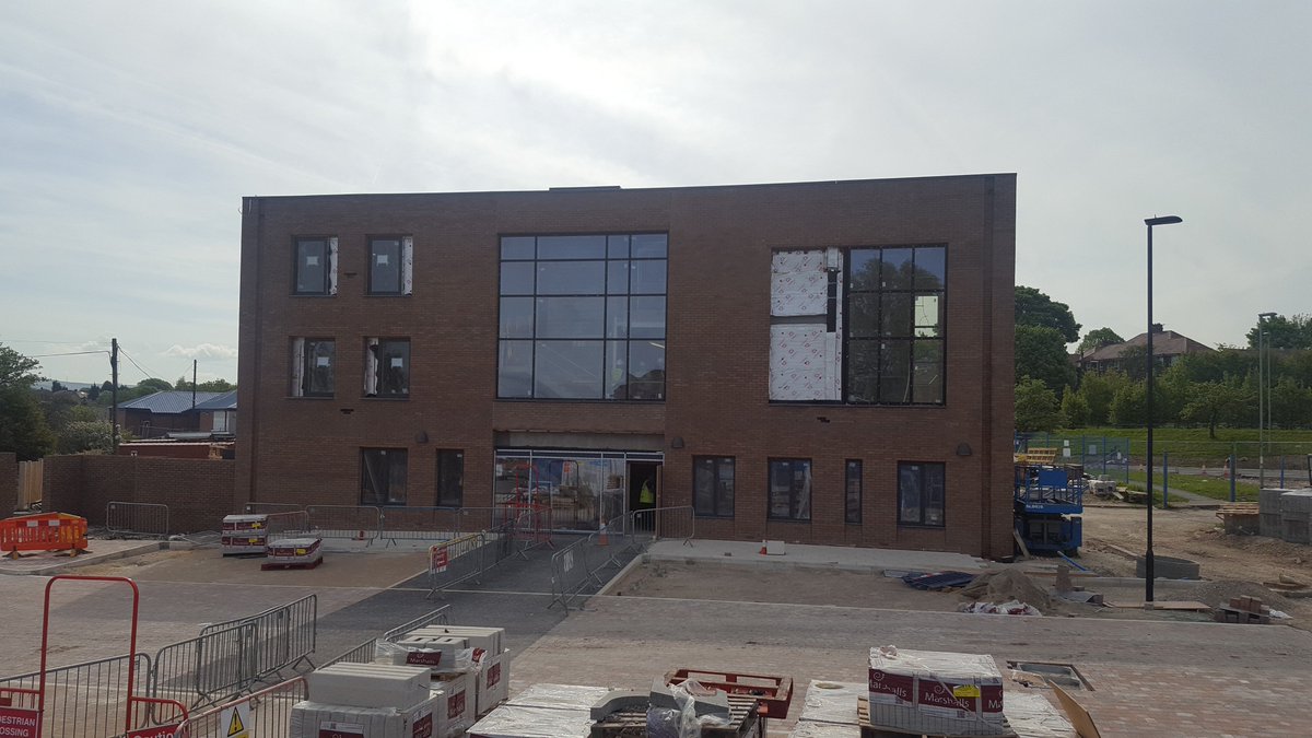 TriangleArch's tweet image. External works progressing and the first splash of colour appearing at the @rbhousing Strand Community Hub in #Kirkholt. Signs up too! #SignsofProgress #Badsignpun