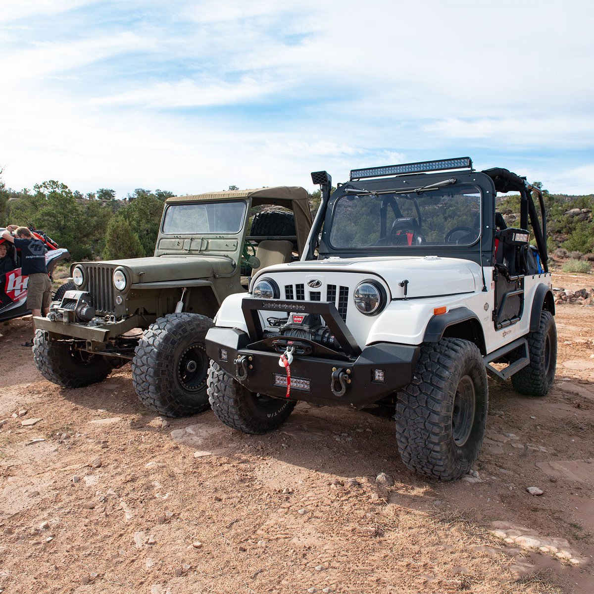 You've probably heard about the Mahindra Roxor side-by-side that looks  a lot like and early CJ 5 or 7. We recently spotted one next to a 1946 CJ-2A and shot these photos to compare them. Pretty close in width, and the Roxor is a bit longer.