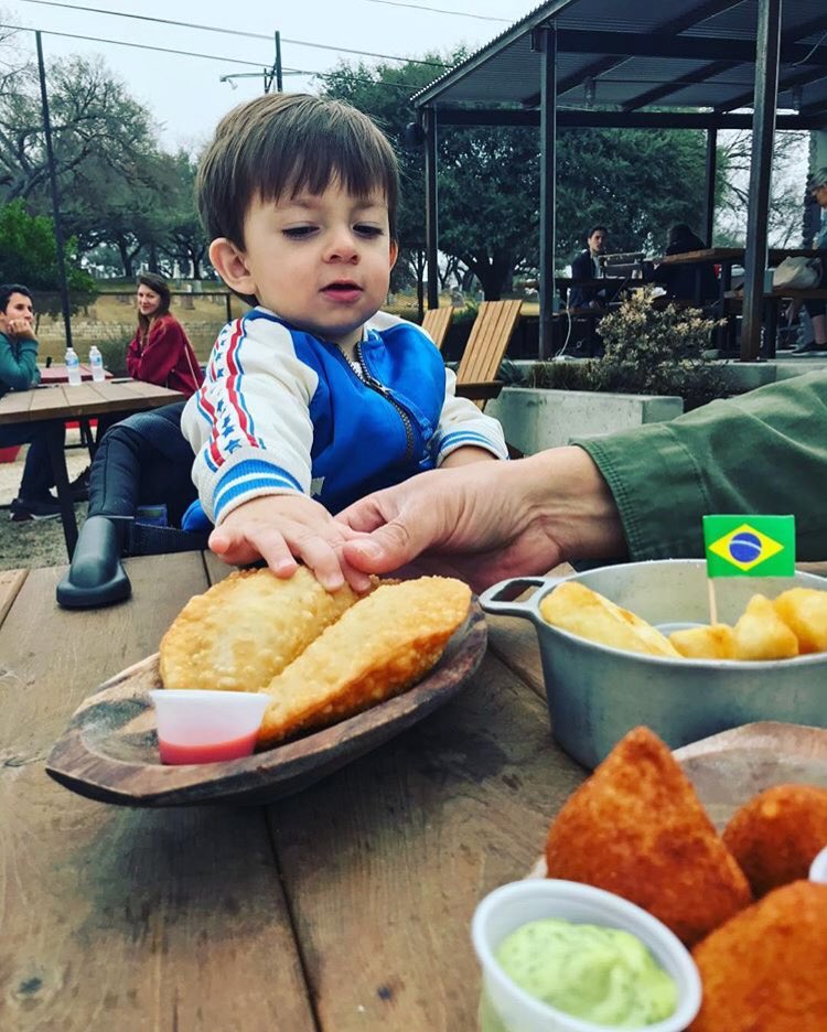 BotecoAtx's tweet photo. This little guy just loves our #salgadinhos, hope dad got to have some too! 🇧🇷🍴🚚 #BotecoATX #KidApproved (📸: @criscostarj) https://t.co/2aGmDdlGF3