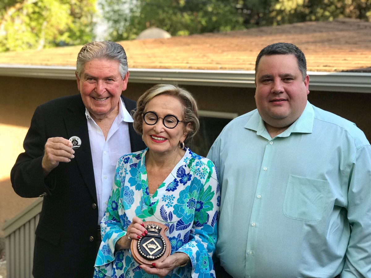 Presenting a ships brass crest, and coin to HMCS Edmonton’s sponsor Esther Starkman, and her Husband Howard Starkman.