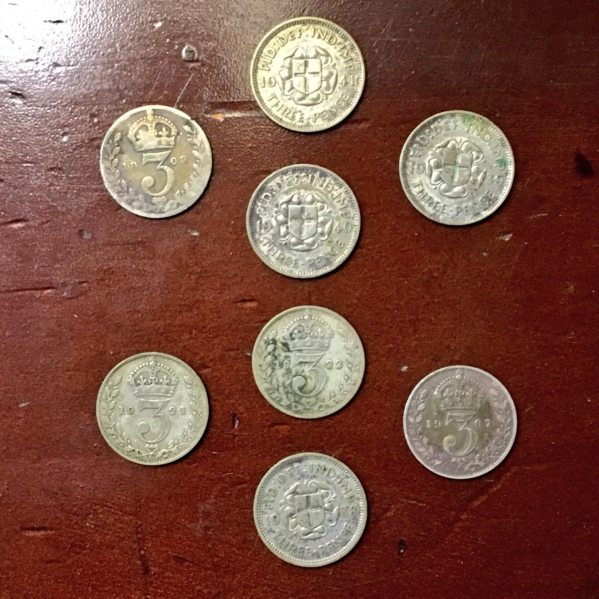 CabinetCoin's tweet photo. Eight silver threepence pieces, a gift from my aunt. https://t.co/zPYdttTwgY