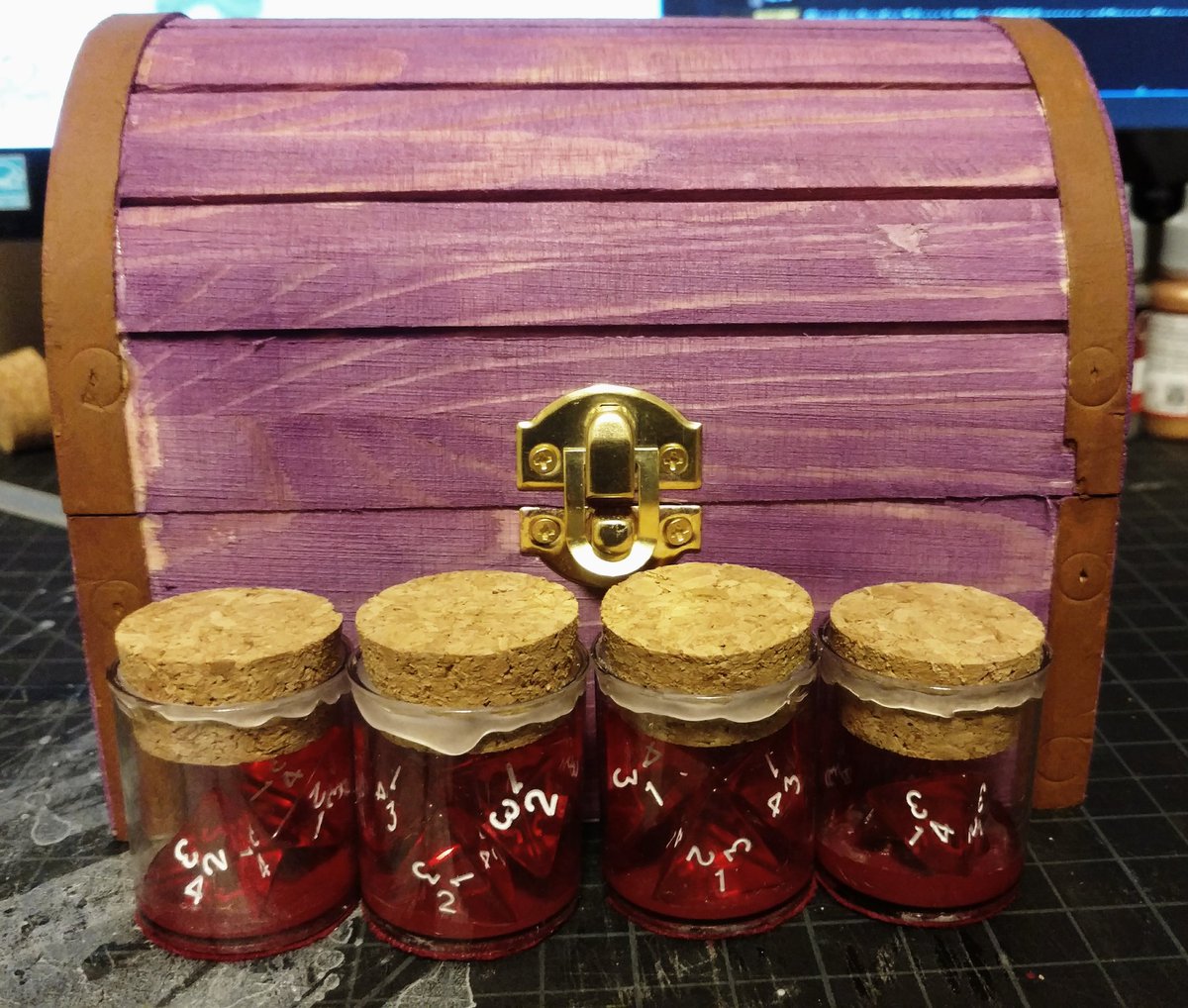 HuntersOfNyrr's tweet photo. It wasn't pretty, but I got there...the figurines and potions go in the box, with an initial foam insert to hold them all well. Dice set for each, and a nice 'leather' notebook. Think I'll replace the tacks that left those marks #dnd #dnd5e #dungeonsanddragons #rpg #dmPride https://t.co/yq1C3SAviU