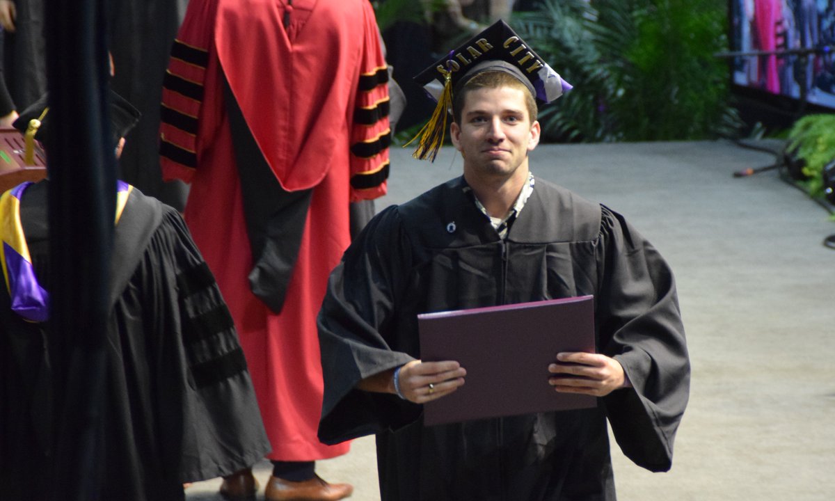 HomeOnKauai's tweet photo. Congrats to @StigRegan on his graduation from @emerskunks! There is a story behind the @solarcity decor... #oldswagclothesskunks. #proudmama https://t.co/9cdLS6lm6D